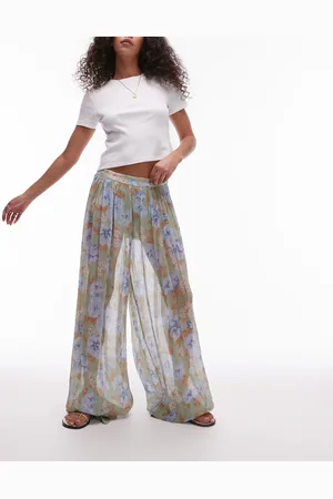 MANGO – Voluminöse Hose in Blassblau mit verblasstem Blumenmuster