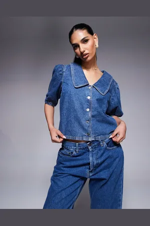 River Island – Denim-Oberteil in mittelblauer Waschung mit Puffärmeln
