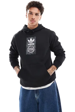 adidas – Kapuzenpullover in mit Military-Muster-Detail