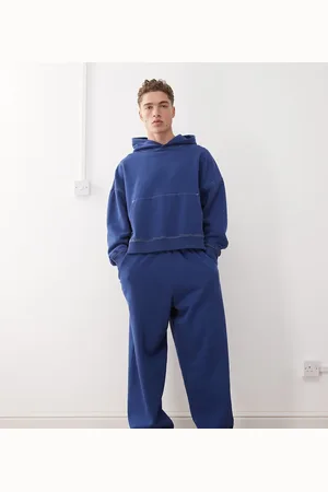 COLLUSION – Lässige Baggy-Jogginghose in verwaschenem Marineblau