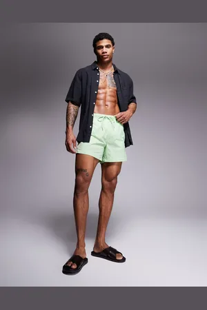 HUGO BOSS – Fab – Badeshorts in Hellgrün mit Streifen-Logo