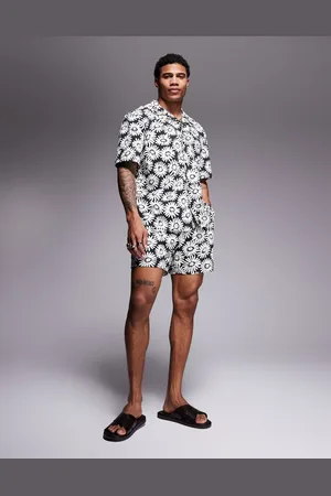 HUGO BOSS – Dazzy – Buntes Set mit Gänseblümchenmuster, aus kurzärmligem Strandhemd und Badeshorts