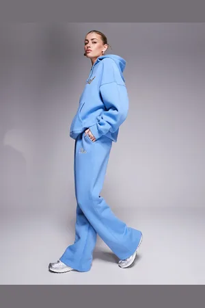 Kaiia – Weit geschnittene Jogginghose in Blau und Gelb mit gesticktem Logo-Schriftzug, Kombiteil