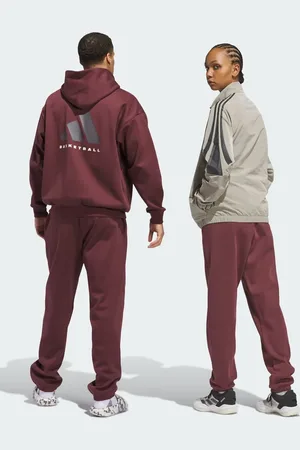 adidas – Adidas Basketball – Unisex-Jogginghose aus Fleece in Aurora Ruby und Braun