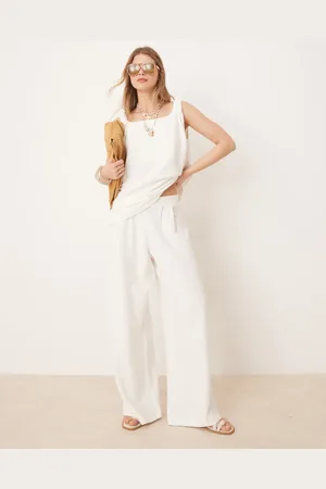 ASOS – Weit geschnittene Bundfaltenhose aus Bouclé-Jersey in
