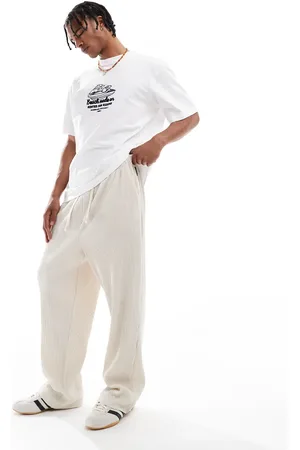 JACK & JONES – Locker geschnittene, plissierte Jogginghose in Creme
