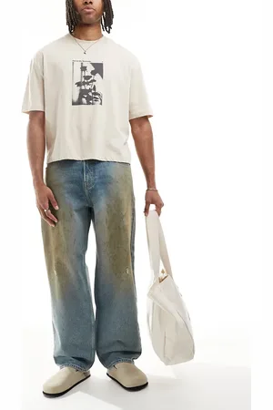 Hollister – Weite Skater-Jeans in mittelblauer Waschung mit Zierfettflecken