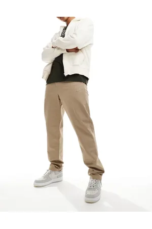 Nike Club – Gewebte Hose in Beige