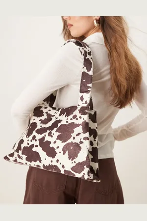 My Accessories – Schmal zulaufende Schultertasche mit Kuhmuster