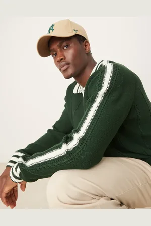 ASOS – Gerippter, locker geschnittener Polopullover in Dunkelgrün mit Zierstreifen und Nahtdetail