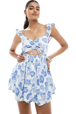 Hollister – Playsuit mit Zierausschnitt, blauem Blumenmuster und Flatterärmeln