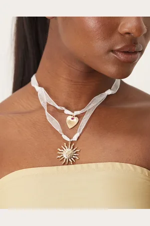 ASOS – Schleifenband-Halskette mit Sonnenanhänger in Goldoptik
