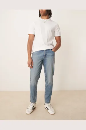 ASOS – Karottenjeans in mittelblauer Waschung