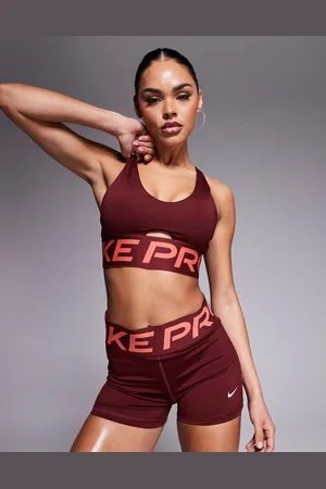 Nike Nike – Pro Training Indy Dri-FIT – Sport-BH in Burgunderrot mit tiefem Ausschnitt und leichter Stützkraft