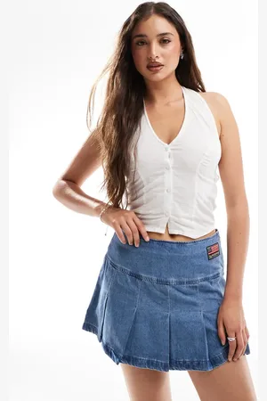 Superdry – Mini-Faltenrock in Vintage-Waschung mit Aufnäher