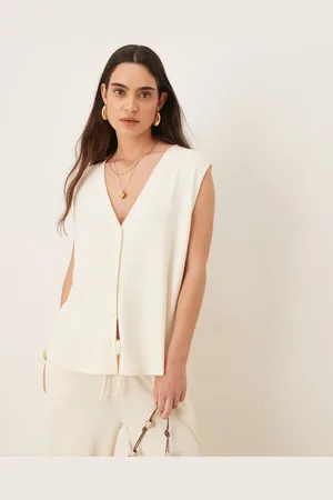 ASOS – Strukturierte Oversize-Weste aus Strick in Creme