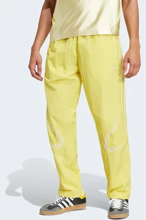 adidas – Adicolor 2000s – Trainingshose aus Webstoff in Pure Sulfur und Powder Yellow