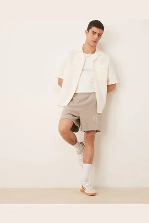 Calvin Klein – Jersey-Shorts in Beige mit Logo-Applikation