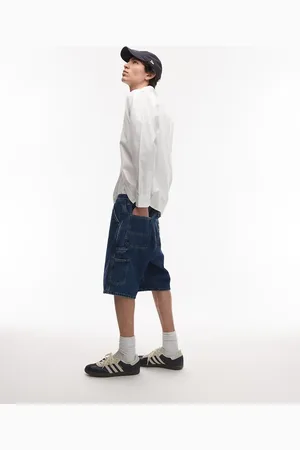 Carhartt – Jeans-Jorts in mittelblauer Waschung mit einfacher Stofflage im Kniebereich