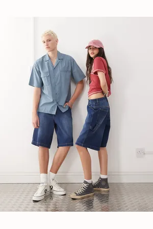 Reclaimed – Unisex-Skater-Shorts aus Denim in blauer Waschung