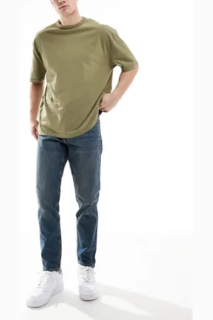 ASOS – Stretch-Karottenjeans in dunkelblauer Waschung