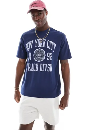 Cotton On Cotton On – Locker geschnittenes College-T-Shirt in Indigoblau mit „NY Track“-Grafikprint