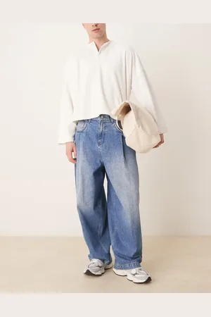 ASOS – Weite Oversize-Jeans in verwaschenem Mittelblau mit Falten an den Taschen