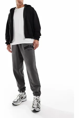 Tommy Hilfiger – Locker geschnittene College-Jogginghose in verwaschenem Grau