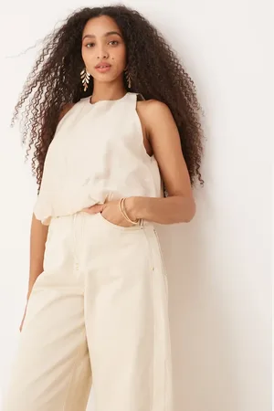 MANGO – Ärmelloses Top in Beige mit weichem Ballonsaum und Rundhalsausschnitt