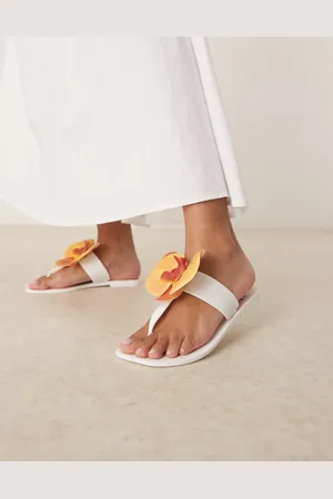 ASOS – Flutter – Jelly-Zehenstegsandalen in mit Orchidee-Detail