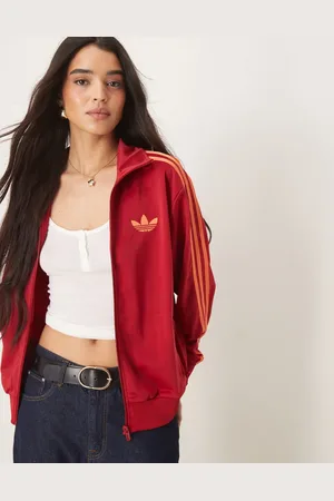 adidas – Firebird Loose – Locker sitzendes Trainingsoberteil in und Orange