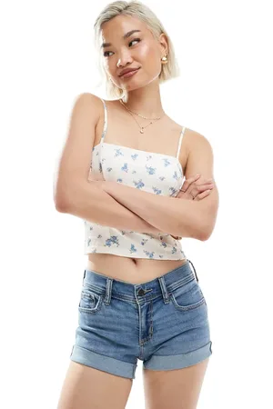 Hollister – Mini-Jeansshorts in mittelblauer Vintage-Waschung mit niedrigem Bund und kontrastierendem Saumaufschlag