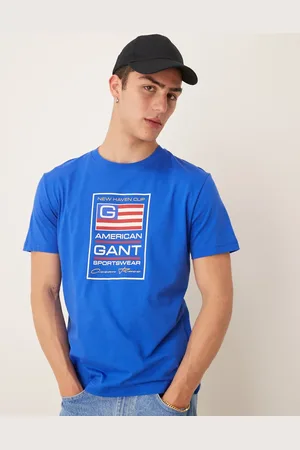 GANT – T-Shirt in Mittelblau mit „USA“-Flaggen-Logoprint