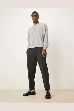 ASOS – Schmal zulaufende, locker geschnittene Jogginghose in schwarzer Neopren-Optik mit Biesen