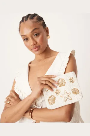 Accessorize – Beuteltasche in Creme mit Muschel-Verzierungen