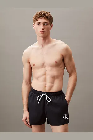 Calvin Klein Kurze Badeshorts mit Kordelzug - CK Monogram