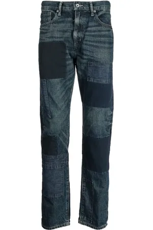 NEIGHBORHOOD Ausgeblichene Jeans mit Patches