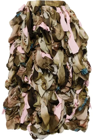 Comme des Garçons Midirock im Layering-Look