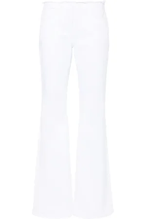 Givenchy Tief sitzende Schlagjeans mit ungesäumten Details