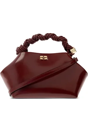 Ganni Clutch mit verdrehtem Henkel