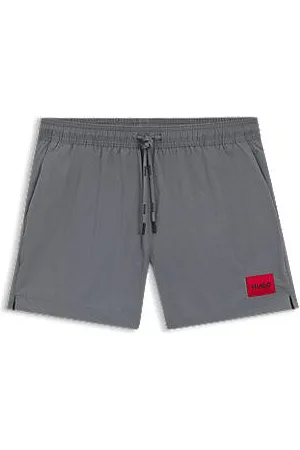 HUGO BOSS Badeshorts mit durchgehendem Innenfutter und rotem Logo-Label