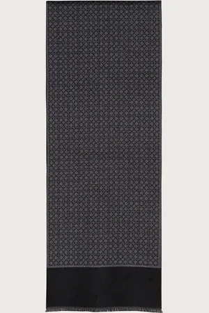 Salvatore Ferragamo This pure wool scarf decorated with an all over Gancini pattern has an elegant look and iconic details