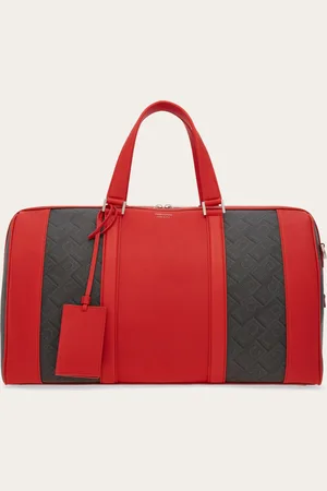 Salvatore Ferragamo Die Reisetasche ist ideal für Wochenendausflüge oder Geschäftsreisen und wird hier aus Funktionsgewebe, verziert mit dem -Monogram-Dessin und mit Details aus geschmeidigem Kalbsleder in Kontrastfarbe mit edlem Farbblock-Effekt angeboten